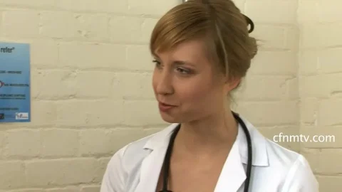 Blonde doctor examines muscular black guy